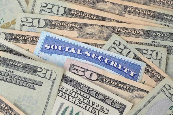 social security card in pile of money 600x400 1  56203e8912487