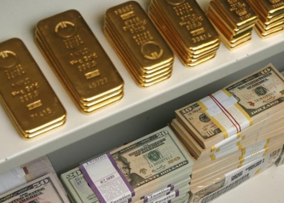 currency wars gold bars and us dollar bills are pictured in a safe in a bank in vien 581x416 1  571791d13e882