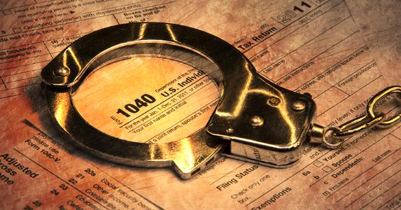 handcuffs on tax form 1040 573x300 1  5745c80920ea2